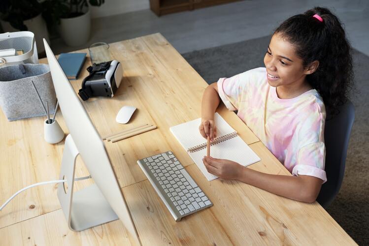 a student learning on a desktop