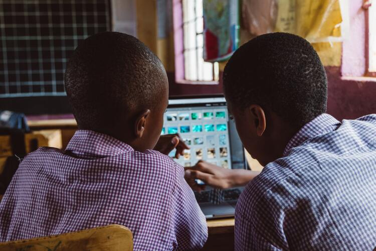 Two students learning on an online teaching software