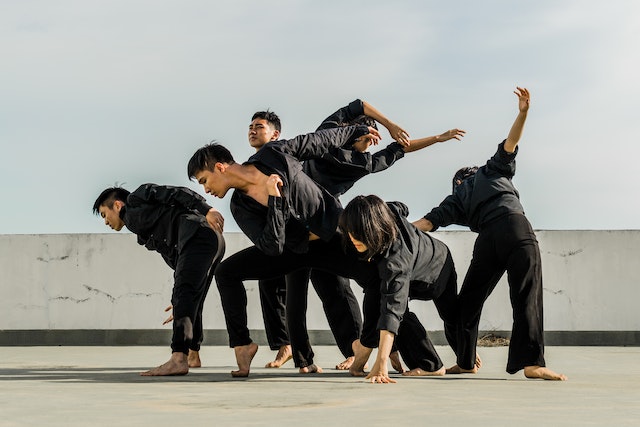 A group of people dancing in an open space