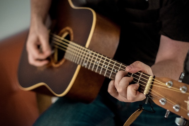 A person playing guitar