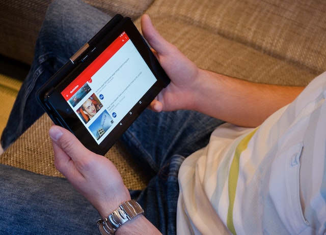 Someone using youtube on a tablet