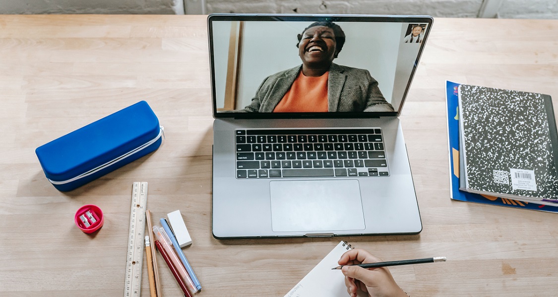 Person teaching on laptop