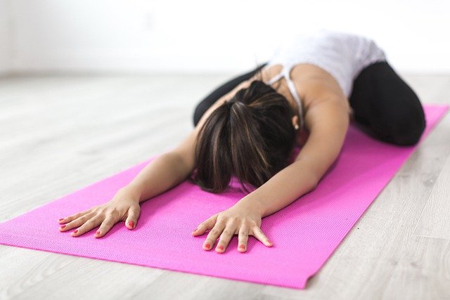 A woman doing a yoga stretch