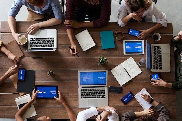 A team sitting together on a desk