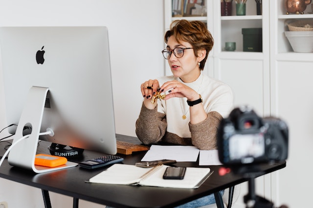 Woman teaching on laptop