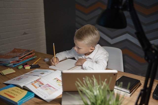 A child studying on his desk