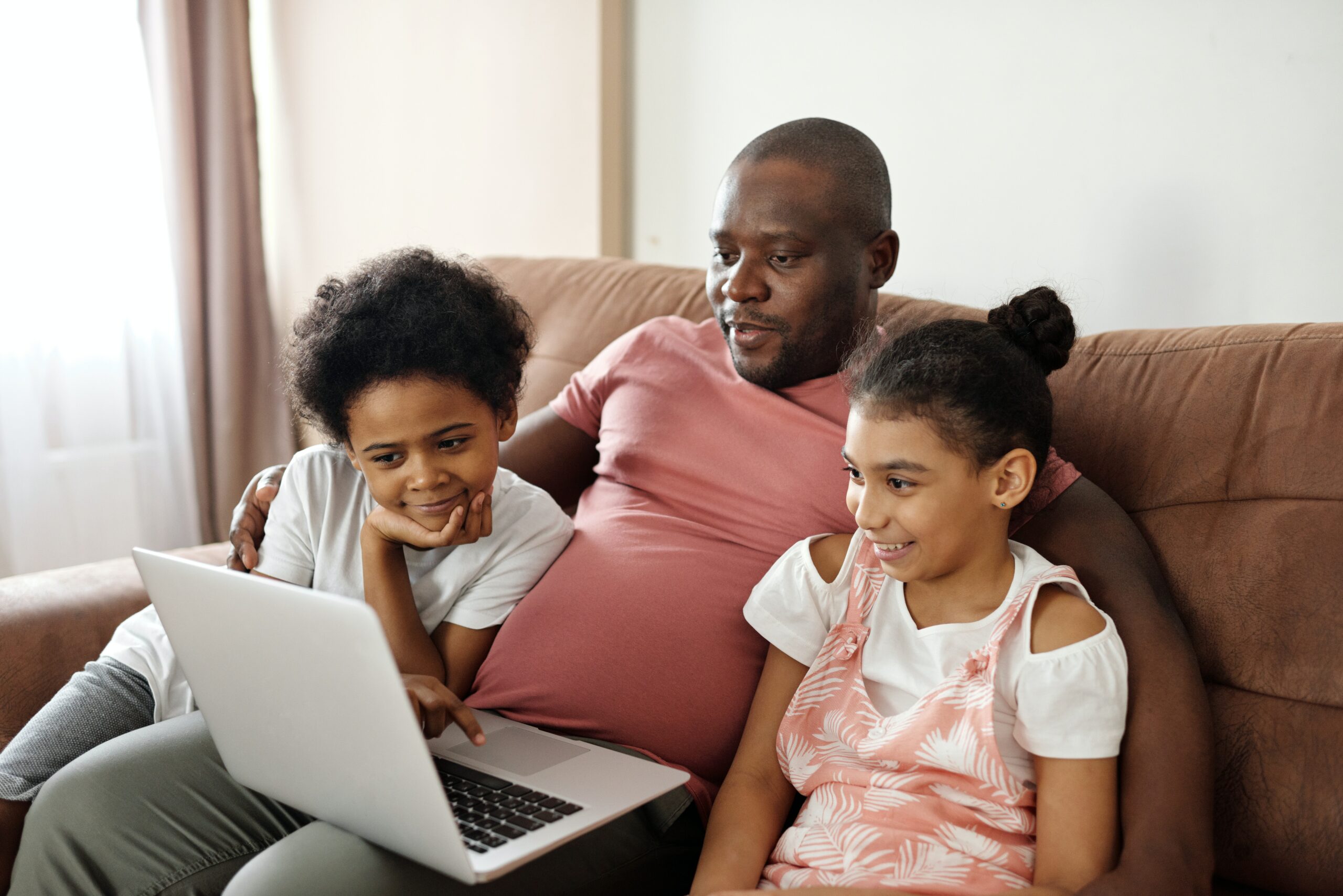 A group of people streaming something on laptop