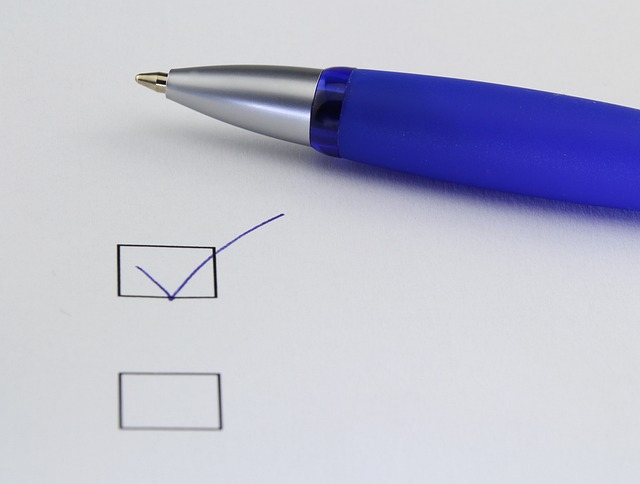 A pen choosing between two tick marks