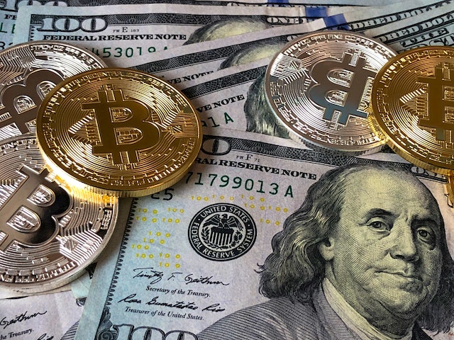 a picture of money and physical representations of bitcoin