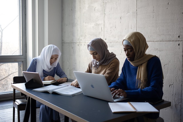 Couple of muslim women partaking in an online course selling platform