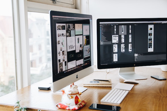 Two monitors showing photoshop