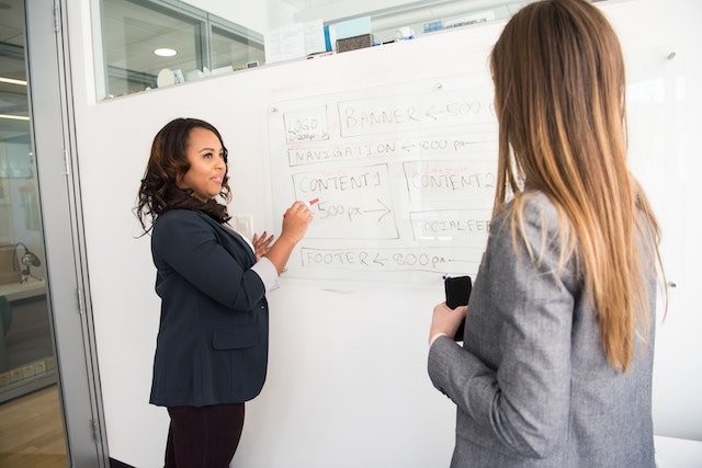 A woman teaching another woman