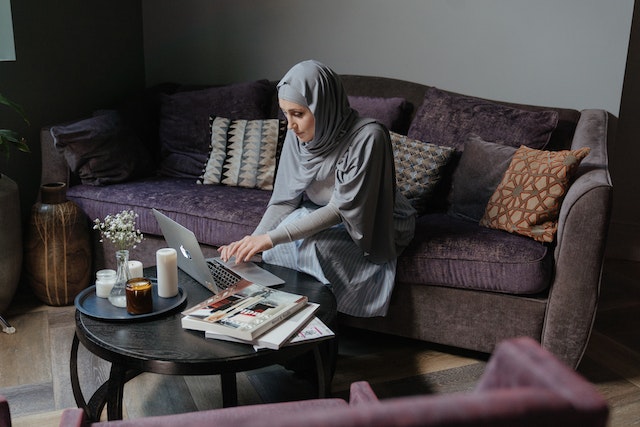 a hijabi woman learning