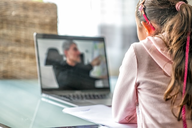 A woman learning something from laptop