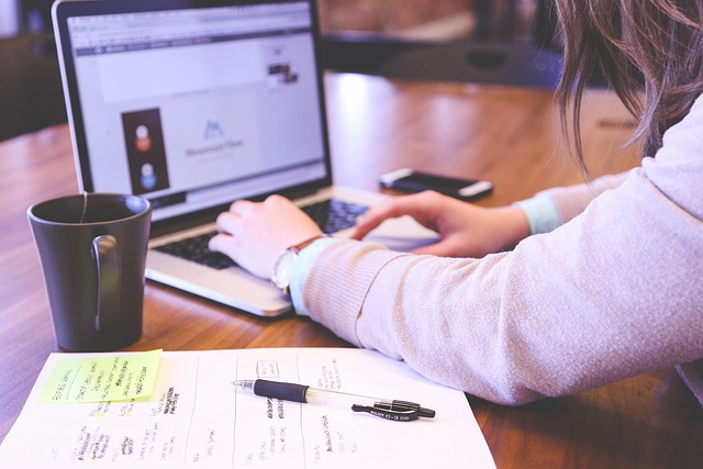 A student working independently at their desk with a focused expression