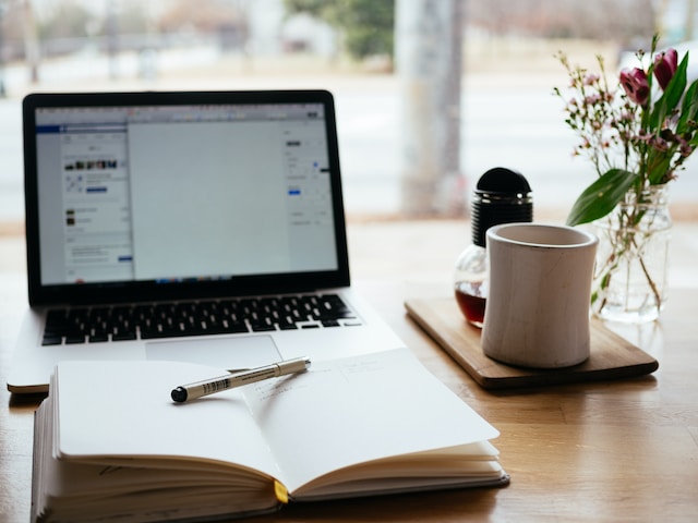 a basic webinar setup with a diary and a laptop