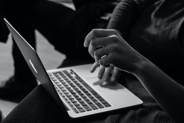 person typing on keyboard