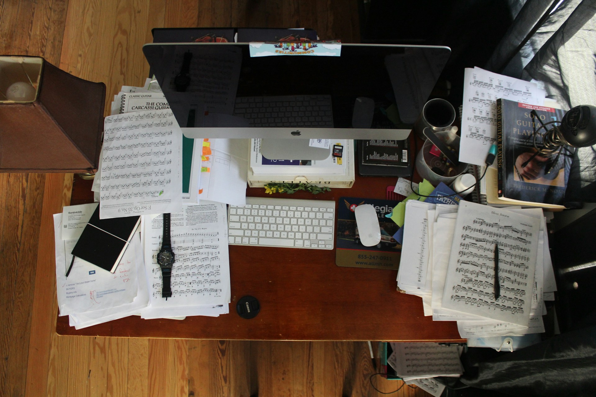 cluttered office desk before they centralize student records across multiple locations